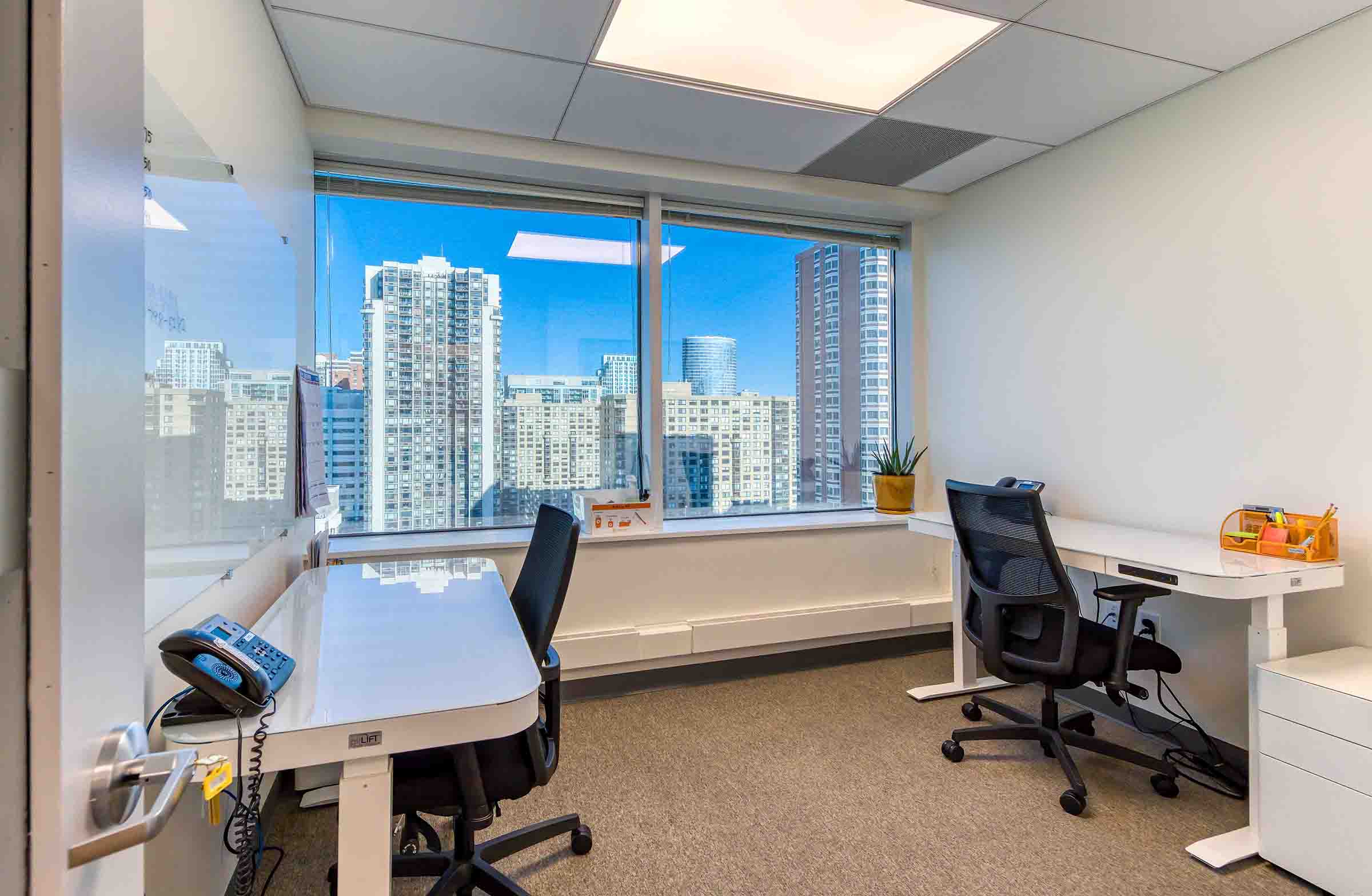 Fully furnished private office space with flexible plans offering stunning views of the Jersey City